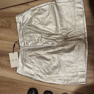 Silver mini skirt size med brand new